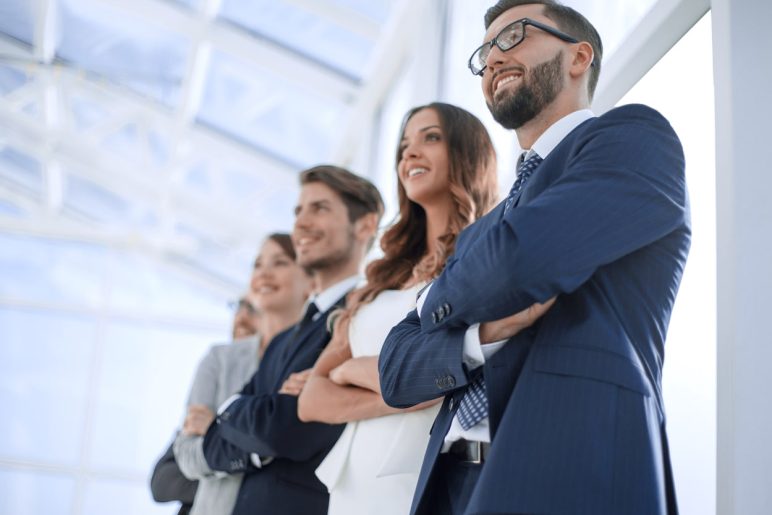 Diverse team of professionals looking forward, choosing an interim manager with Diktu